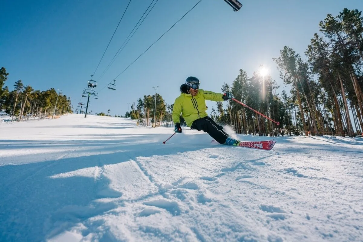 Skier dropping a powder turn above Winter Park